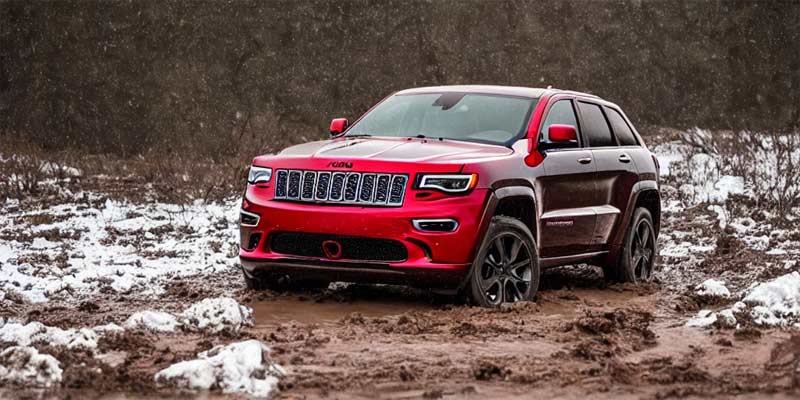 red-2023-Jeep-Grand-Cherokee-in-mud-and-snow